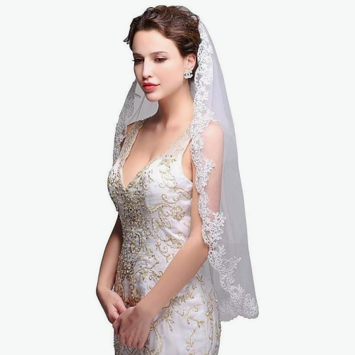 Bridal veil lace appliques with special flower patterns at the...