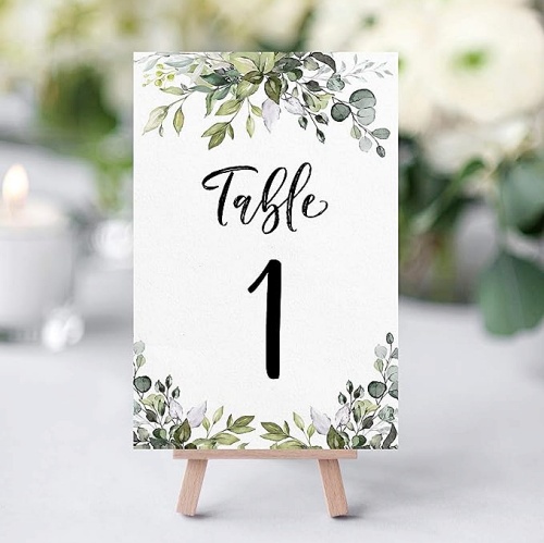 Unique table numbers wedding reception set of 1-25 and a table head table card in a floral and happy green eucalyptus design