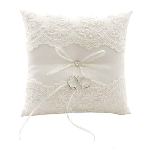 Ivory wedding ring pillow in a romantic design with lace...
