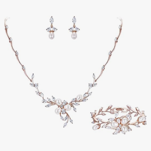 Bridal pearl earrings and necklace set for a wedding in a stunning floral design with pearls and crystal leaves