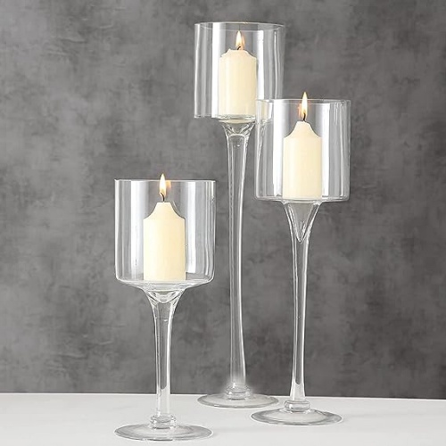 Tall glass tea light candle holders A perfect set of 3 transparent candle holders designed in 3 different heights to create a romantic and asymmetrical look that is pleasing to the eye