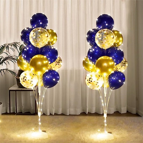 Balloon stand with string light and pole in a creative...
