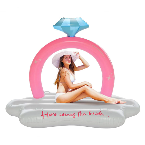 Giant bling ring pool float Huge diamond ring with the inscription “Here Comes The Bride” in magical blue and pink colors